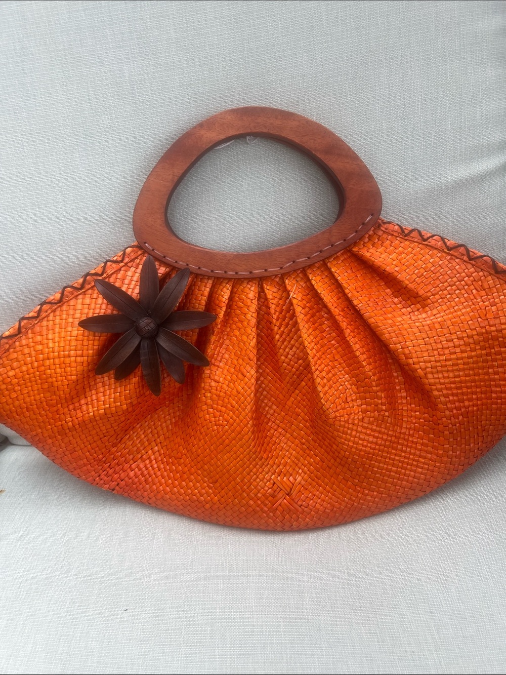 Beautiful like new straw orange bag with wooden handles